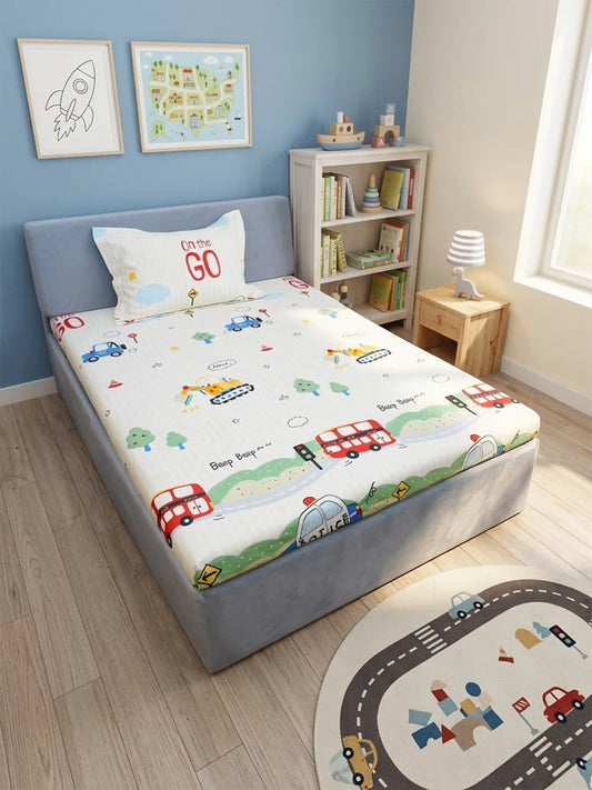 Children's bedroom with a single bed featuring a colorful car-themed bedsheet